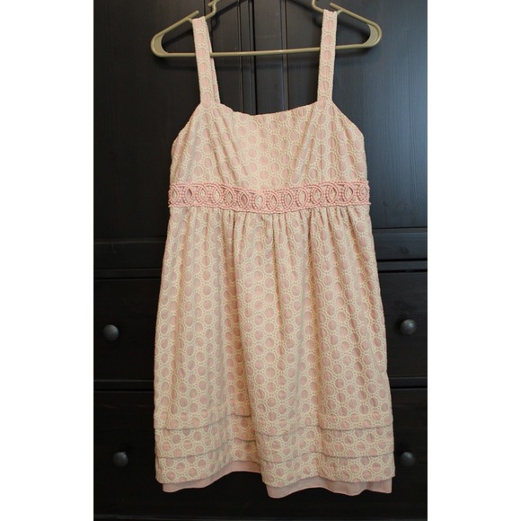 Adorable light pink dress with cream embroidery.