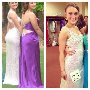 I am selling a white sequenced prom dress.