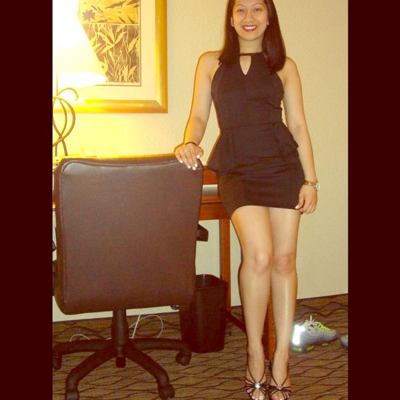 Black form fitting peplum dress