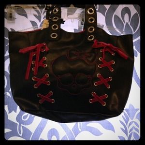 Pink and black skull purse