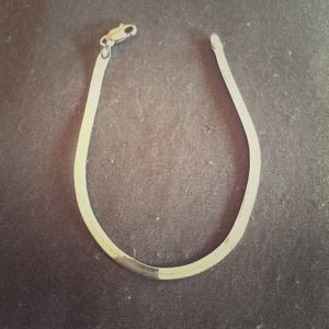 Sterling silver herringbone bracelet.