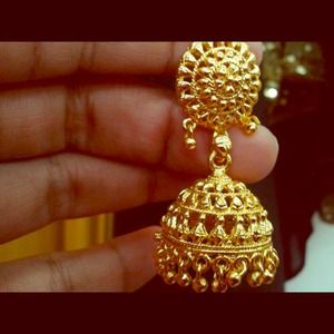 Artificial earrings look like real gold