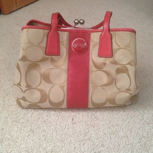 Coral and tan Coach handbag