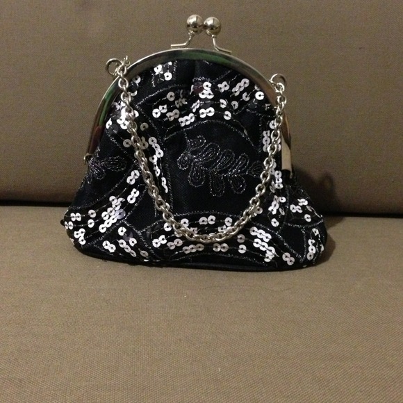 Small sequined black evening bag with chain strap