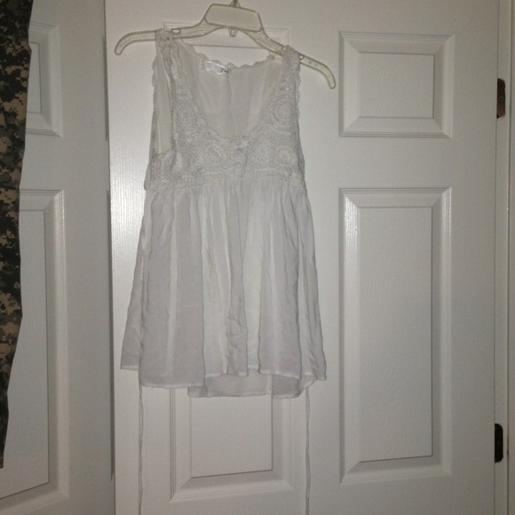 White sleeveless tie back top crochet detail