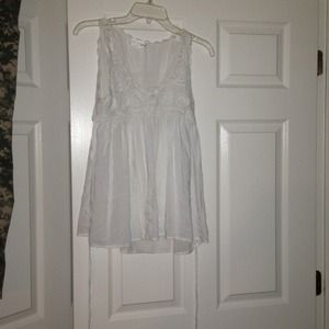 White sleeveless tie back top crochet detail