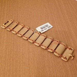 Goldstone bracelet with leather cord detail.