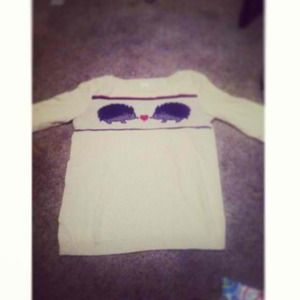 sweater with a little porcupine on it
