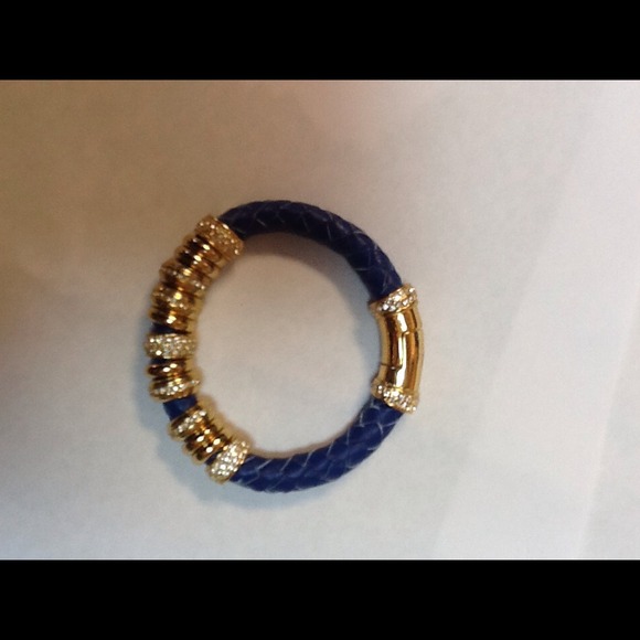 Royal blue braided bracelet with 13 rings .