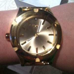 Nixon men's watch. Worn about 6 times. Gold.