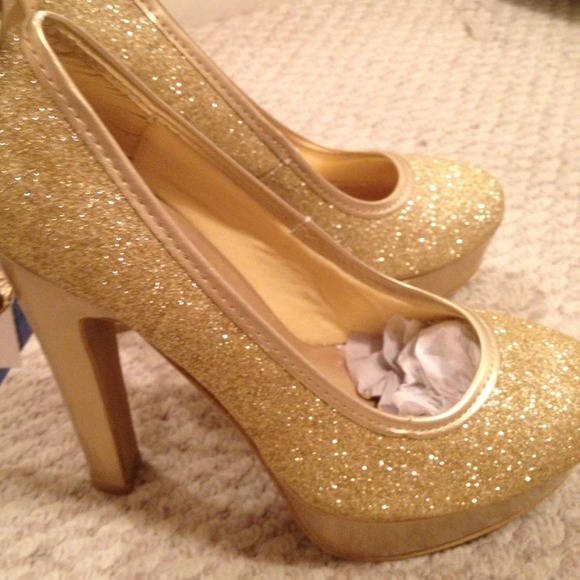Gold glitter pumps with a strap around the ankle!