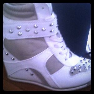 White and grey high top, wedge, with spikes.