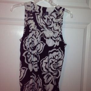 Very cute black and white flower top with beading