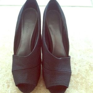 Black heels, plus blue and white shirt