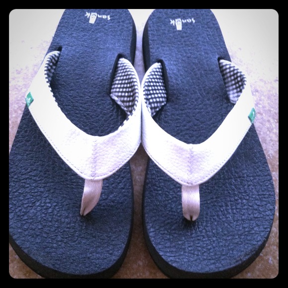 Hold! White Sanuk flip flops!