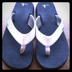 Hold! White Sanuk flip flops!