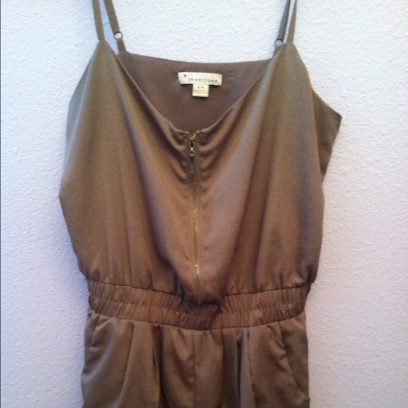 Tan romper with a gold zipper
