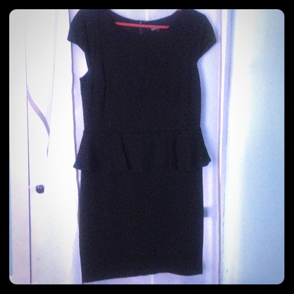 Never worn with tag. Black peplum dress with lace.