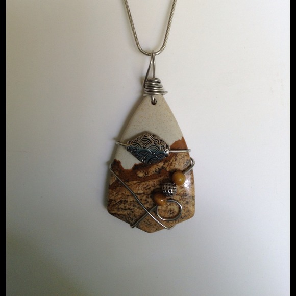 Necklace with polished stone pendant.
