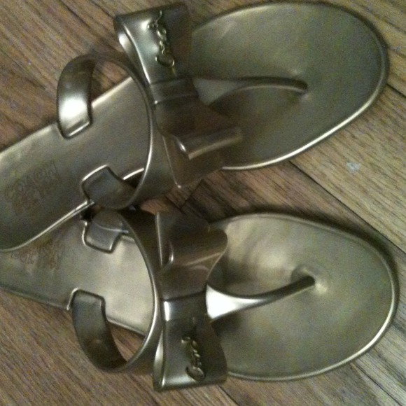 Brand new Coach gold jelly flip flop.  Size 7