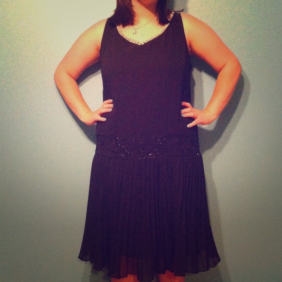 Black flapper type dress.