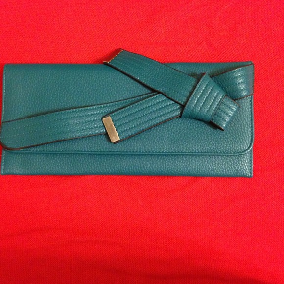 Jessica Simpson teal colored clutch.