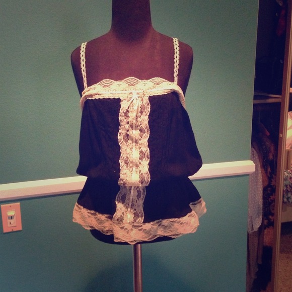 FOREIGN EXCHANGE Black peplum tank w/ lace detail