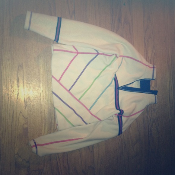 White fleece with multi-colored stitching lines