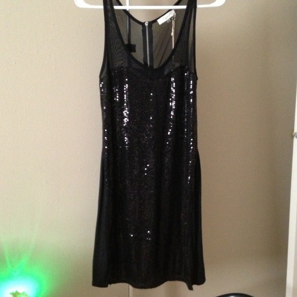 Black sequin and sheer top dress.