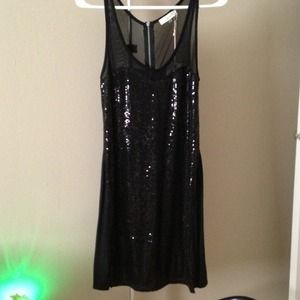 Black sequin and sheer top dress.