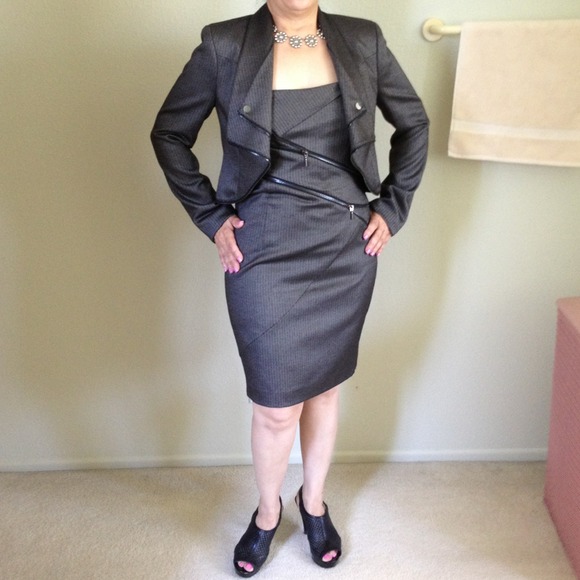 A dark grey zipper dress with a matching jacket