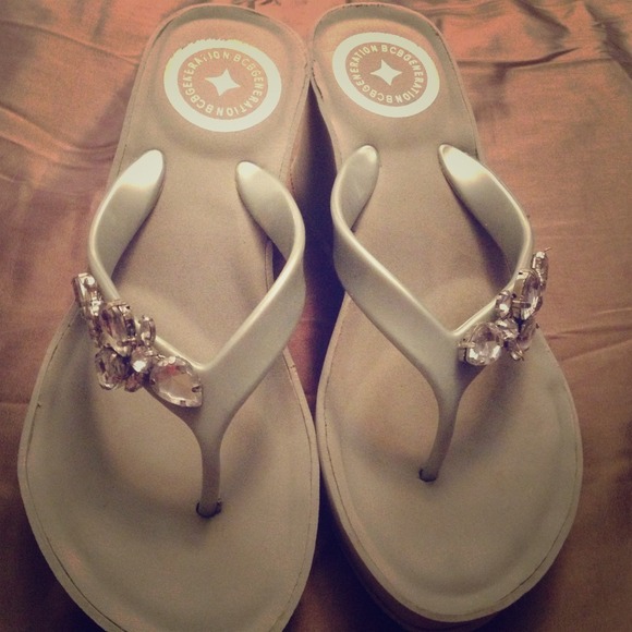 Silver wedge flip flops by BCBGeneration. Size 9.