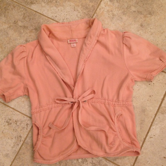 Pink jacket ties at waist and has side pockets.