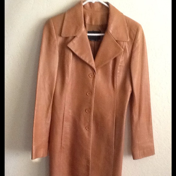 Tan color long coat style 100% leather jacket.