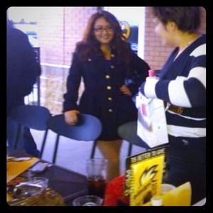 Black coat with gold buttons.