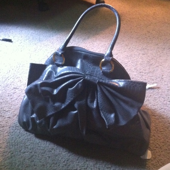 Giant bow snake skin looking purse