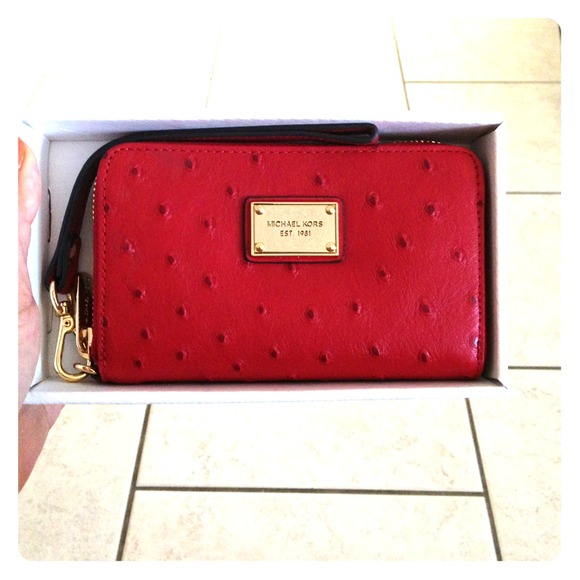 Brand new Michael Kors wallet/iPhone case.