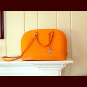 Pulicati orange bucket bag.