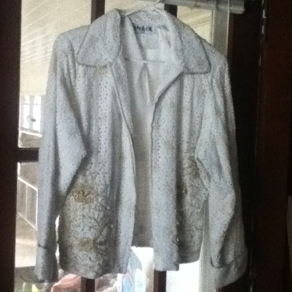 White lace zipper jacket. Gold accents.