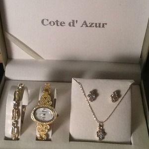 Gold toned jewelry ensemble with fashion watch