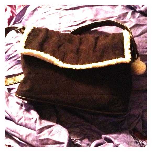 Brown purse with fluffy white inside