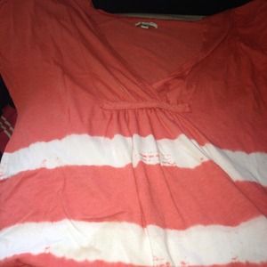 Orange and white shirt. V-neck.