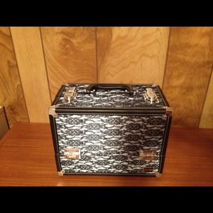Make-up/storage box with locking closure.