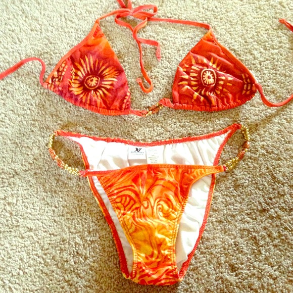 Never worn, beautiful sun burst beaded swim suit!!