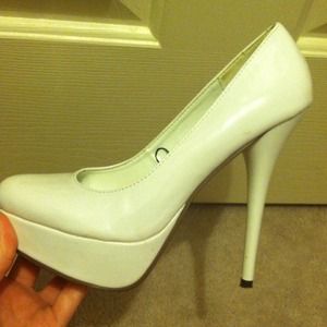 White platform pumps