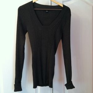 Dark gray sweater/shirt with cuffs at wrists.