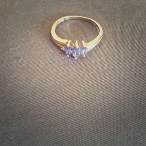10k gold ring with 3 tanzanite stones.