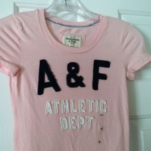 Light pink tee with navy blue lettering