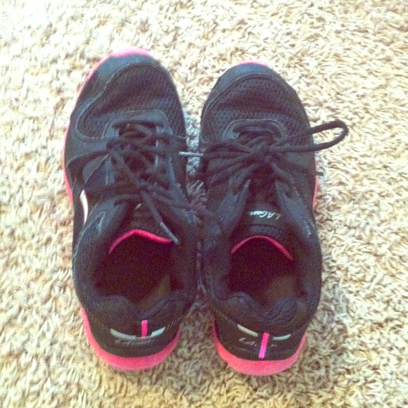Pink and black running shoes