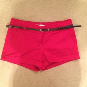 Red shorts with black belt